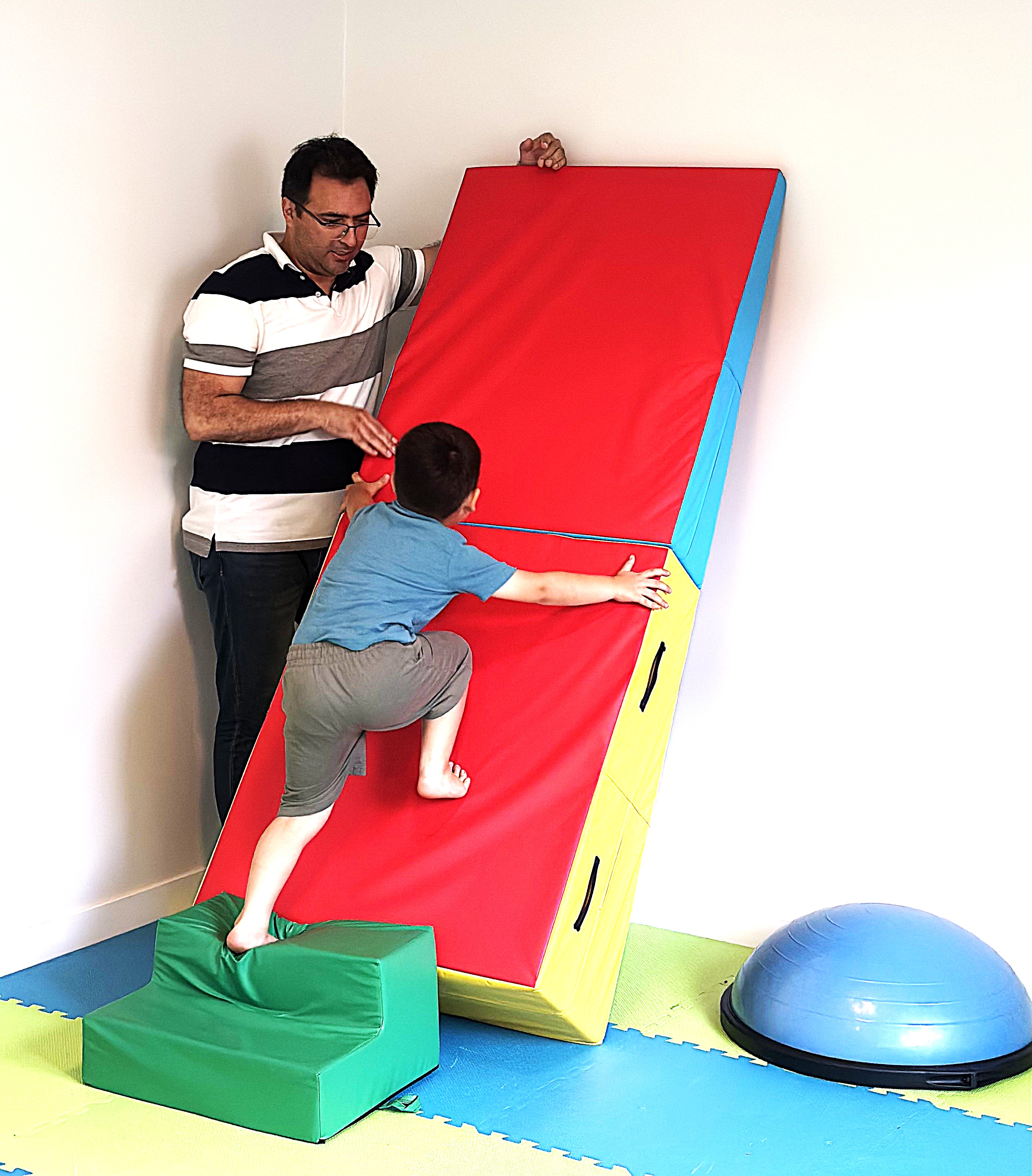 Dr. Amin Gholami conducting customized program with child